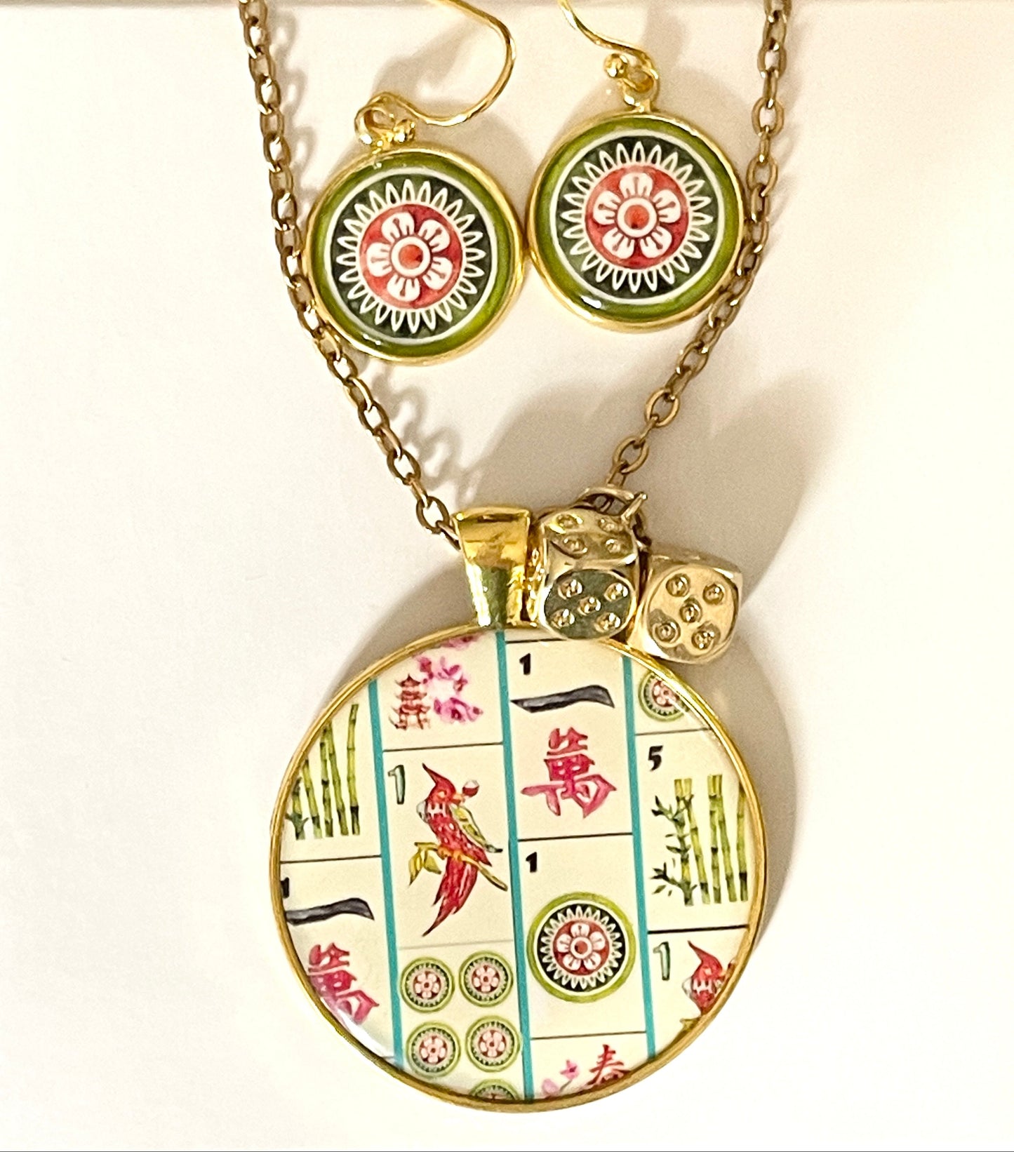 Jewelry set with pendant and earrings on a yellow background