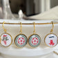 gold mahjong earrings of crack dot and bird bam