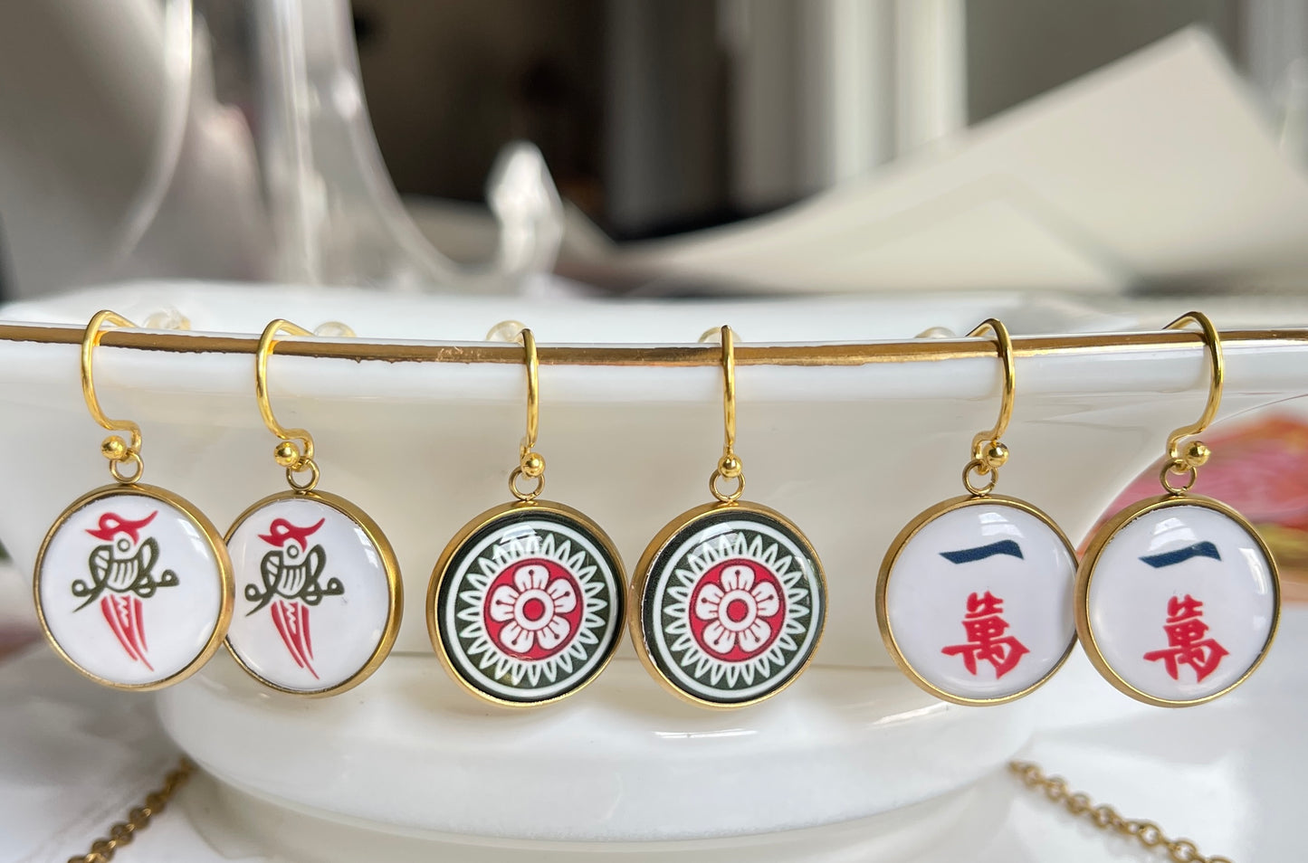 gold mahjong earrings of crack dot and bird bam